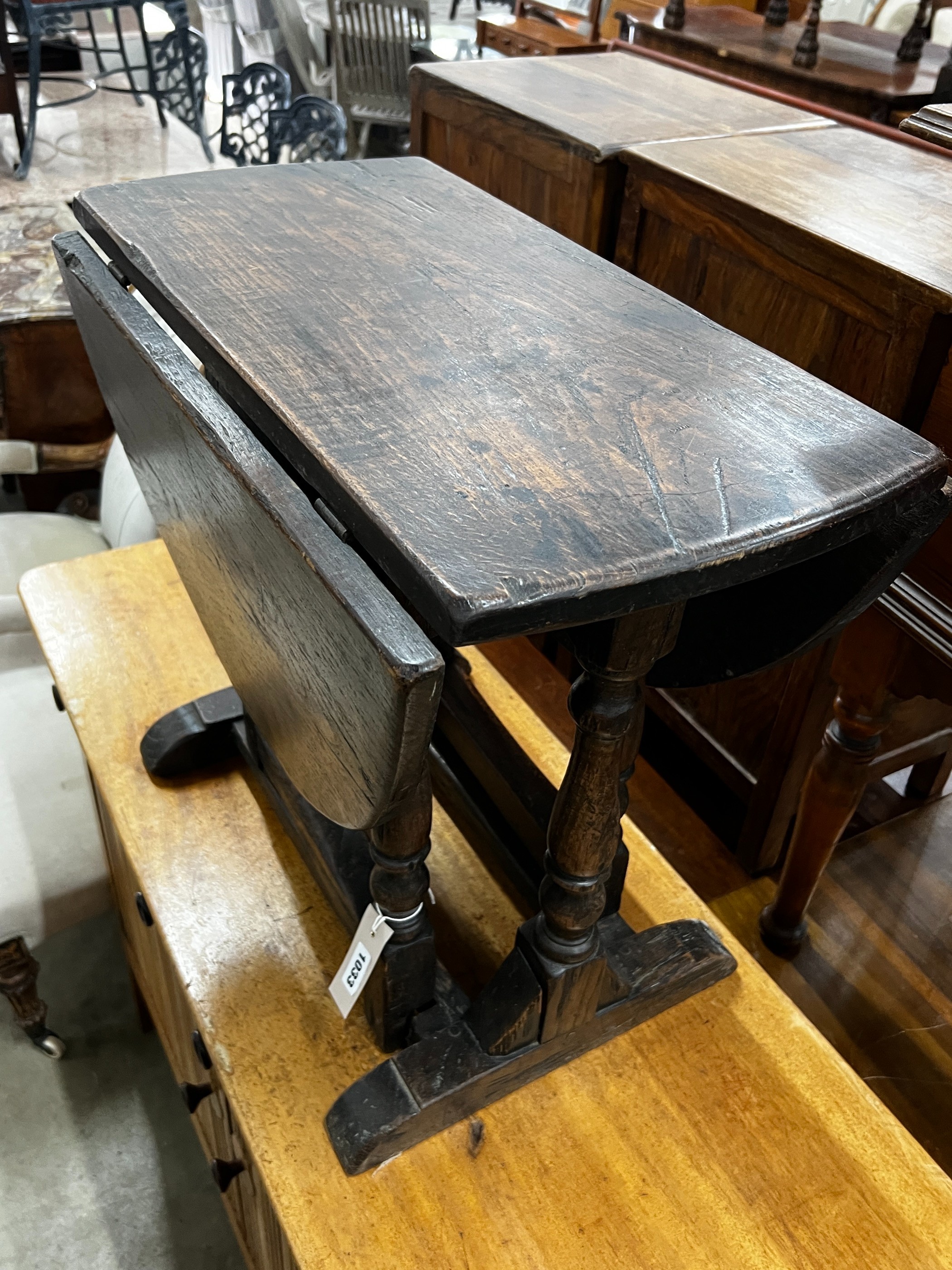 A small 17th century style oak gateleg occasional table, width 61cm, depth 34cm, height 53cm